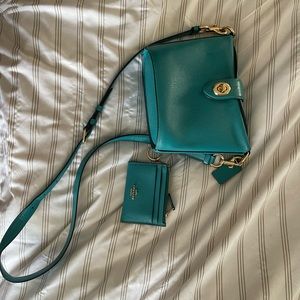 Teal Coach bucket bag with matching mini wallet